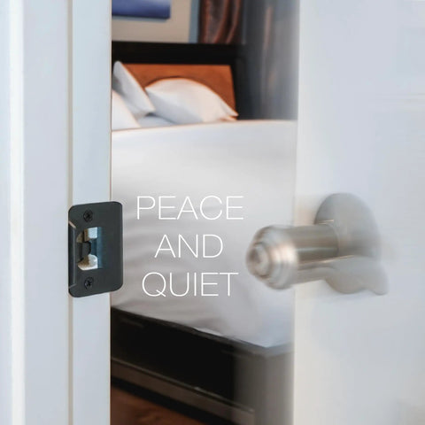 Enhanced Door Silencer Strike Plate With Adhesive Bump Stops For Instant Quiet And Total Slam Defense installed on door frame.