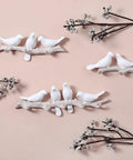 Five Hook Wall Mounted Coat Rack With Decorative Bird Design Built To Hold Heavy Gear Smoothly Perfect For Entryway And Bedroom Storage To Keep Your House Neat And Seriously Slick In Blue with white bird motifs.