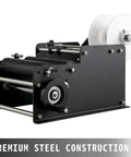 VFLDKRQAWYS MT-30 Semi-Automatic Bottle Labeling Machine For Plastic Glass Metal Round Cylinders DIY Desktop Applicator With Electrical Adhesive Printer And Sturdy Steel Construction Speed Control, showing premium steel construction and rollers.