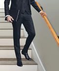 Rock Solid Pine Wood Stair Handrail With Legit Heavy Duty Metal Brackets And Smooth Rounded Corners For Reliable Indoor Wall Mount Support Carrying Groceries Or Packages No Sweat, viewed with a man in a suit on stairs.
