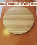 Built Different Wooden Lazy Susan Turntable With 360 Smooth Swivel Rotation For Dining Tables Kitchen Islands Black Serving Tray on a long table.