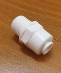 Push To Connect Tube Fitting One Quarter NPT Male To One Quarter OD Tube Quick Connector For Water Purifiers And RO DI Filtration Systems White 10 Pack Easy Install Durable Construction For Home And Industrial Use on wooden surface