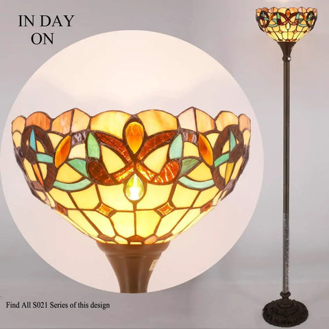 Tiffany Style Floor Lamp with 12 Inch Stained Glass Shade 71 Inch Tall Antique Bronze Base Uplight Torchier turned on.