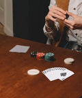 Person holding cards at table with 2 Sets Sublimation Blank Poker Cards 2.55 By 3.54 Inches White Deck Kit For Heat Transfer Printing DIY