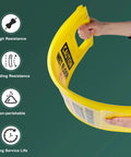 Person holding flexible Yellow Caution Wet Floor Sign demonstrating resistance; part of Six Pack 24 Inch Yellow Caution Wet Floor Signs
