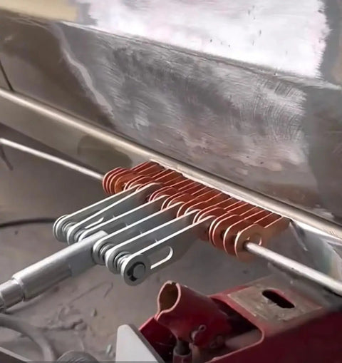 Dent Pulling Rings Set 60Pcs for Car Body Panel Repair and Spot Welding Machines in use on metal surface