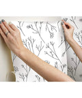 Applying Green And White Twigs Peel And Stick Wallpaper Roll, 20.5 Inch Wide By 16.5 Feet Long, No Water Or Paste needed, on wall