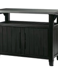 Unity XL Portable Outdoor Table With Stainless Steel Top For Kitchen Prep And Outdoor Storage Cabinet For Grillin Accessories In Dark Grey With 78 Gallon Total Storage And Durable All Weather Resin Build, showing closed cabinet with hooks.