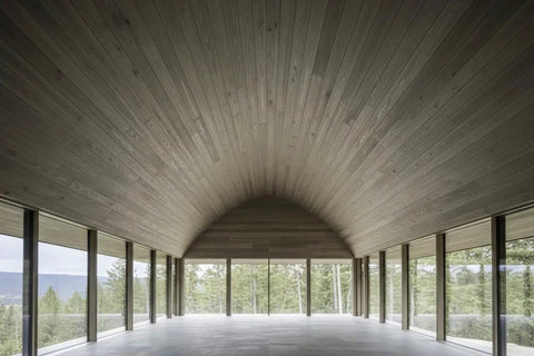 Chill Coastal Beachwood Water Based Wood Stain Zero VOC used on vaulted wood ceiling in spacious room with large windows.
