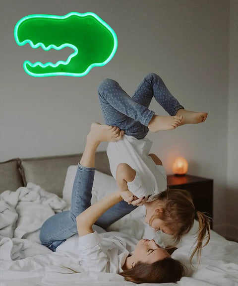 Green Totally Lit Dinosaur Head Neon Sign For Kids Bedroom Decor USB Or Battery Powered Neon Light glows on wall.