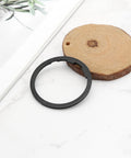 Two Pack Bike Flywheel Cassette Spacer 1.8mm Flywheel Gasket For Eight Nine Ten Eleven Speed Mountain Bikes Easy Install Tight Fit Reduces Shake 40.5 By 34.7 mm Black displayed on wooden surface.