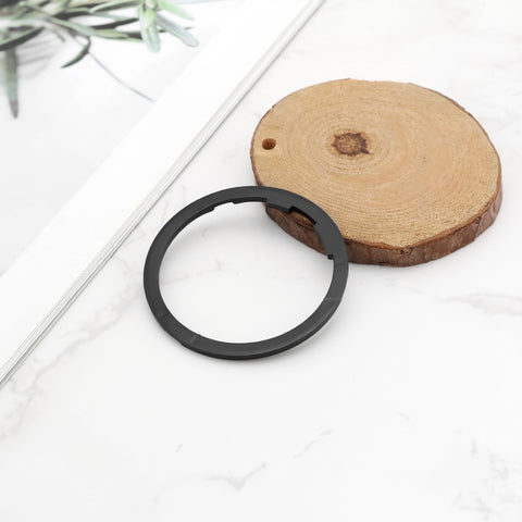 Two Pack Bike Flywheel Cassette Spacer 1.8mm Flywheel Gasket For Eight Nine Ten Eleven Speed Mountain Bikes Easy Install Tight Fit Reduces Shake 40.5 By 34.7 mm Black displayed on wooden surface.