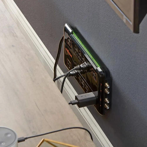Wall-mounted 12 Outlet Surge Protector Power Strip with 3420 Joules, 2 coax ports, and corner outlets for large adapters.
