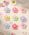 Pastel Jelly Daisy Flower Shoe Charms Set With Glossy Bling Floral Buckles in assorted pastel colors on a soft background.