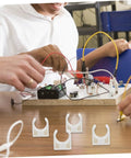 Front view of ARTIBETTER white plastic motor clamp brackets for DC brush motors; four brackets visible.