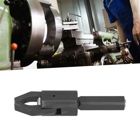 Beefy Alloy Steel CNC Bar Puller For Lathes with hardened handle and integrated jaws, shown in workshop setting.
