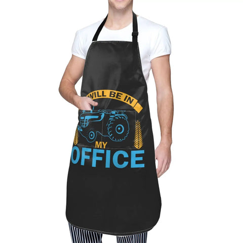 Person wearing a black Waterproof Adjustable Bib Apron With Pockets For Men And Women Durable Polyester Keeps Your Clothes Clean from Oil and Dust