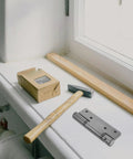 Stainless Steel Self Closing Door Hinge With Hydraulic Buffer For Wooden Doors In Office And Kitchen on window sill with tools