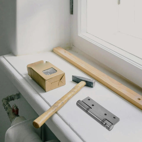 Hidden Stainless Steel Door Hinges For Wood Doors shown with wooden plank and hammer on white surface