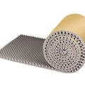 Slick Self Adhesive Acoustic Foam Panels 2Cm Thick Sound Dampening Wall Tiles rolled up and laid flat, ideal for echo reduction.