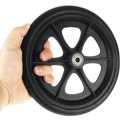 Hand holding one 8-inch black wheel from 4 Pcs Replacement Wheelchair Wheels 8 Inch Universal Anti Slip Casters For Wheelchairs Walkers Rollators Black Includes Axle Screws Fits Most 8 Inch Frames With 7.87 Inch Diameter And 0.94 Inch Rim Width