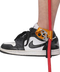 Foot Ascender For Climbing And Rappelling, Lightweight Aluminum Alloy Device In Right Orange, shown with shoe and rope