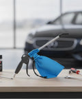 Badass Pneumatic Blower Vacuum For Shop Chores And Auto Detailing With Slick Metal Tube Lightweight Grip Sturdy Collection Bag on workbench