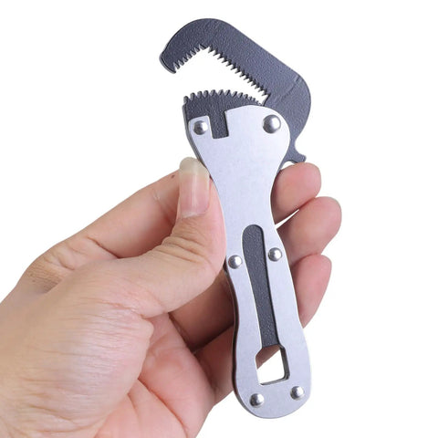 Miniature Rough Wrench Spanner With Ergonomic Grip For Quick Fixes In Furniture Assembly Automotive Repairs And Electronics A Compact Handy Tool For Tight Spaces And Precise Adjustments For DIYers And Pros shown in a person's hand, showcasing its compact size and ergonomic grip.