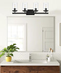 Brushed Brass 5 Light Farmhouse Vanity Lights With Clear Glass Shades in modern bathroom setting, above mirror