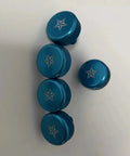 Five blue star-engraved round knobs on a white background