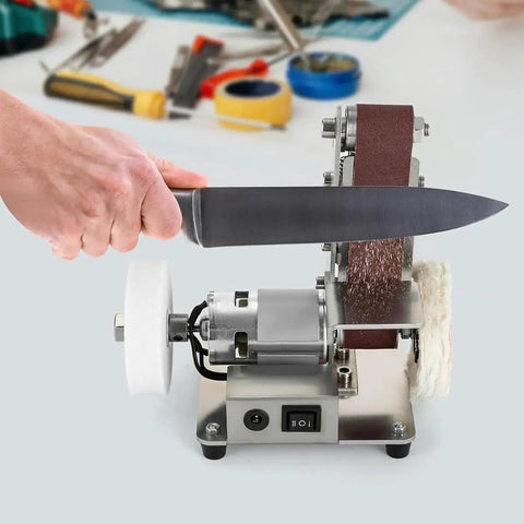 Cool Mini Bench Grinder And Sander Machine With Stainless Steel Build sharpening a knife, showing adjustable speed and reverse mode.