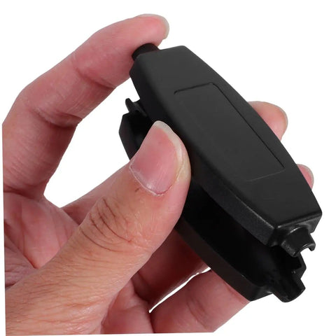Hand holding a black component from 20 Pack ABS Plastic Enclosure Boxes for Electronics Projects PCB Housing Black with Easy Install and Multi Wiring Configs Durable Storage Case for DIY Mods and a Pro Look.