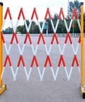 Straight Up Reliable Adjustable Retractable Accordion Safety Gate For Driveways And Pets Quick Expand To Fourteen Feet in red and white, securing a roadway.