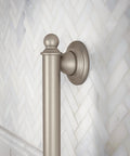 Oil Rubbed Bronze 24 Inch Stainless Steel Bathroom Grab Bar For Safety And Stability Traditional Style Easy Install Coordinate With Brantford Collection Slip Resistant Grip. Close-up of end mount on tile wall.