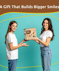 Two women holding a box of Premium Wooden Bird House Kit For Adults Build It Yourself Bird House And DIY Woodworking Project Family Friendly Craft Kit.