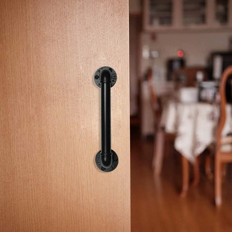 Industrial Pipe Door Pull Handle 12 Inch Black Rustic Grab Bar on wooden door indoors