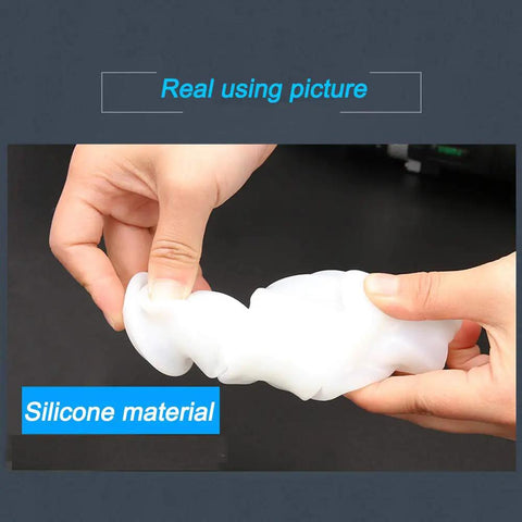 White rubber scalable dust cover for electric hammer drill, showing flexible silicone material, held in hands.