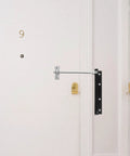 Automatic Door Closer For Home And Gate Black Stainless Steel With Rebound Closing And Anti Rust Feature installed on white door