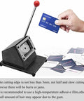 Rugged All Metal Manual PVC Card Die Cutter For Desktop Card Cutting With A Steel Blade And Round Corner Pro Grade Hand Pressure Cutter For PVC Credit Cards And ID Cards Without Burrs being used with credit cards nearby.