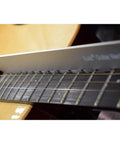 Close-up of adjustable notched guitar neck straight edge tool on fretboard, fits Gibson Fender and most guitars with 25.5 and 24.75 scale.