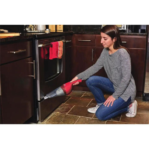 Woman using Compact Lithium Hand Vacuum Kit With 2Ah Battery For Cars And Home Multi Surface Cleaning Lightweight Cordless Design