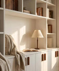Bookshelf with soft lighting showing Solid Walnut Wood Cabinet Handles And Drawer Pulls For Cabinets, Dressers, And Wardrobes.