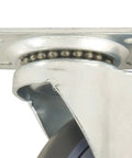 Close-up of a four inch TPR rubber swivel caster wheel with a metal plate and ball bearings for heavy duty use.