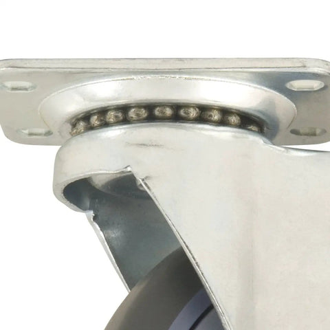 Close-up of a four inch TPR rubber swivel caster wheel with a metal plate and ball bearings for heavy duty use.