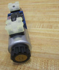 4WE 6 D62/OFEG24N9K4/ZV Directional Solenoid Spool Valve R901068630, 24 VDC 1.25A Single Unit, top view on wooden surface
