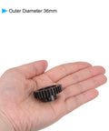 Person holding Mod 1 34T Pinion Gear with 8mm bore, 36mm outer diameter, hardened steel for RC cars and trucks.