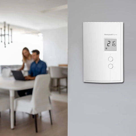 Wall-mounted digital non programmable thermostat for electric baseboard heaters and convectors, featuring silent TRIAC switching.