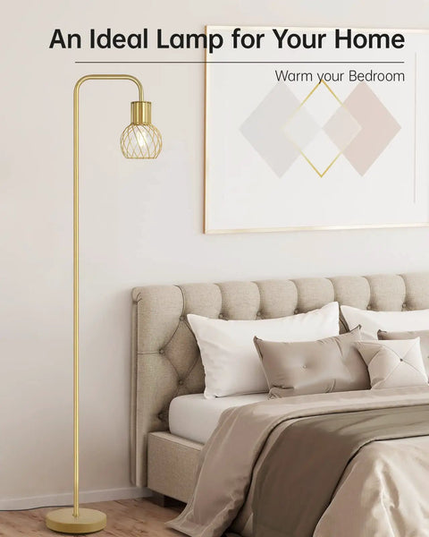 Cozy bedroom scene with brass gold standing floor lamp, modern industrial minimalist style next to bed, art on wall