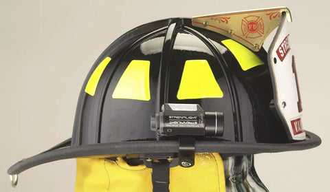 Vantage 140 Lumen Hands Free Helmet Light With Rear Safety LED on black firefighter helmet with secure mounting