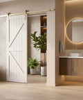 Interior view with gold barn door hardware kit for sliding doors, modern brushed brass finish, 6 ft 7 in track, installed